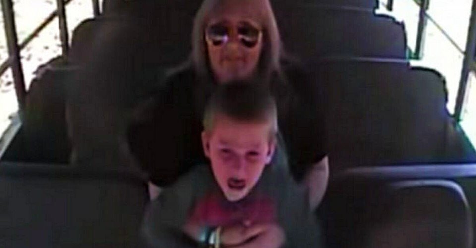 The school bus surveillance camera catches the driver getting up to a terrified little boy