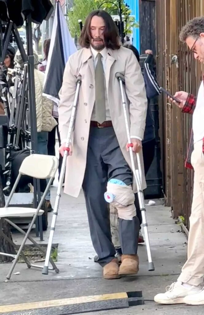Keanu Reeves spotted walking with crutches on Good Fortune set
